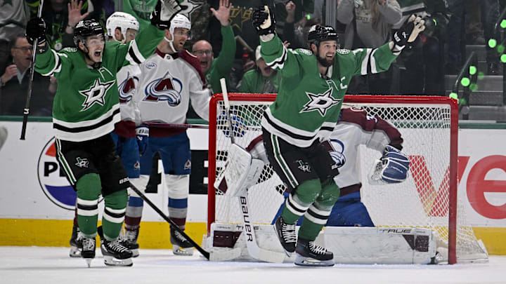 Apr 28, 2025; Dallas, Texas, USA; Dallas Stars left wing Jamie Benn (14) and center Wyatt Johnston (53) celebrate as a shot by defenseman Thomas Harley (not pictured) falls behind the back of Colorado Avalanche goaltender Mackenzie Blackwood (39) during the first period in game five of the first round of the 2025 Stanley Cup Playoffs at American Airlines Center. Mandatory Credit: Jerome Miron-Imagn Images