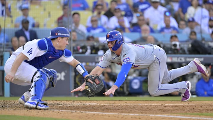 Oct 14, 2024; Los Angeles, California, USA; New York Mets first baseman Pete Alonso (20) slides home to score against Los Angeles Dodgers catcher Will Smith (16) in the ninth inning during game two of the NLCS for the 2024 MLB Playoffs at Dodger Stadium. Mandatory Credit: Jayne Kamin-Oncea-Imagn Images Oct 14, 2024; Los Angeles, California, USA; New York Mets first baseman Pete Alonso (20) slides home to score against Los Angeles Dodgers catcher Will Smith (16) in the ninth inning during game two of the NLCS for the 2024 MLB Playoffs at Dodger Stadium. Mandatory Credit: Jayne Kamin-Oncea-Imagn Images
