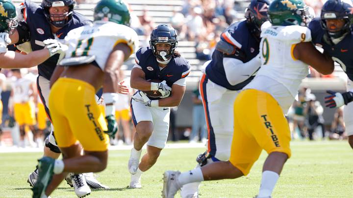 Sep 13, 2025; Charlottesville, Virginia, USA; Virginia Cavaliers running back Noah Vaughn (28) carries the ball against the William & Mary Tribe during the first half at Scott Stadium. Mandatory Credit: Amber Searls-Imagn Images Sep 13, 2025; Charlottesville, Virginia, USA; Virginia Cavaliers running back Noah Vaughn (28) carries the ball against the William & Mary Tribe during the first half at Scott Stadium. Mandatory Credit: Amber Searls-Imagn Images