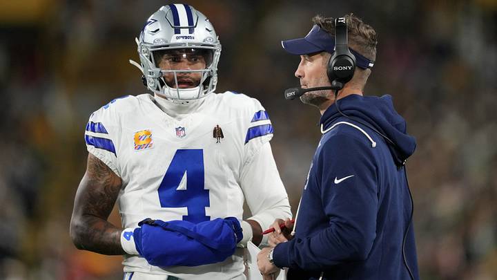 Dallas Cowboys quarterback Dak Prescott (4) talks with Dallas Cowboys head coach Brian Schottenheimer talk during the first quarter against the Green Bay Packers at Lambeau Field. Mandatory Credit: Jeff Hanisch-Imagn Images Dallas Cowboys quarterback Dak Prescott (4) talks with Dallas Cowboys head coach Brian Schottenheimer talk during the first quarter against the Green Bay Packers at Lambeau Field. Mandatory Credit: Jeff Hanisch-Imagn Images