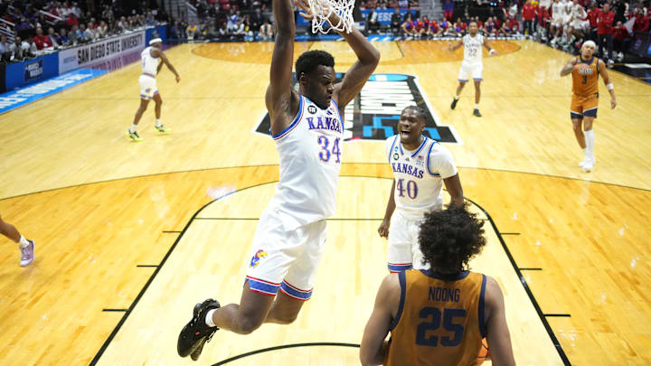 Mar 20, 2026; San Diego, CA, USA; Kansas Jayhawks center Paul Mbiya (34) dunks against the California Baptist Lancers in the first half during a first round game of the men's 2026 NCAA Tournament at Viejas Arena. Mandatory Credit: Kirby Lee-Imagn Images Mar 20, 2026; San Diego, CA, USA; Kansas Jayhawks center Paul Mbiya (34) dunks against the California Baptist Lancers in the first half during a first round game of the men's 2026 NCAA Tournament at Viejas Arena. Mandatory Credit: Kirby Lee-Imagn Images