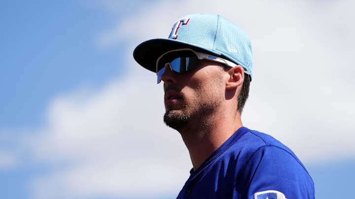 Mar 6, 2025; Phoenix, Arizona, USA; Texas Rangers outfielder Evan Carter (32) looks on against the Los Angeles Dodgers during the first inning at Camelback Ranch-Glendale. 