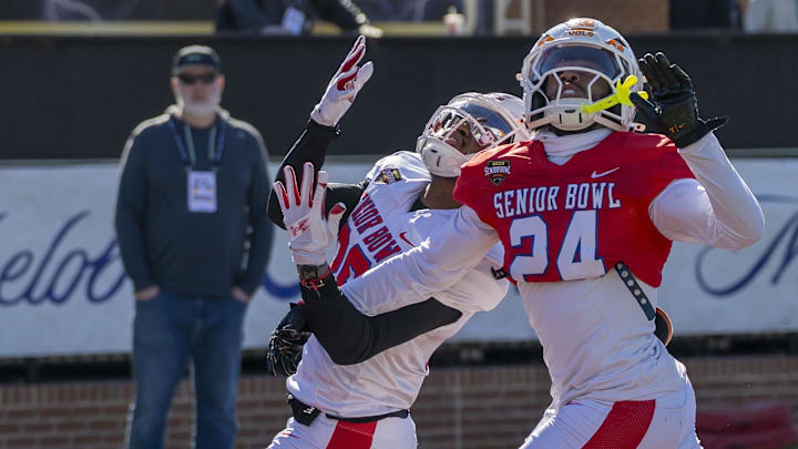 National Team wide receiver Vinny Anthony II of Wisconsin works against National Team cornerback Jalen McMurray (24) of Tennessee during National Senior Bowl practice at Hancock Whitney Stadium. National Team wide receiver Vinny Anthony II of Wisconsin works against National Team cornerback Jalen McMurray (24) of Tennessee during National Senior Bowl practice at Hancock Whitney Stadium.