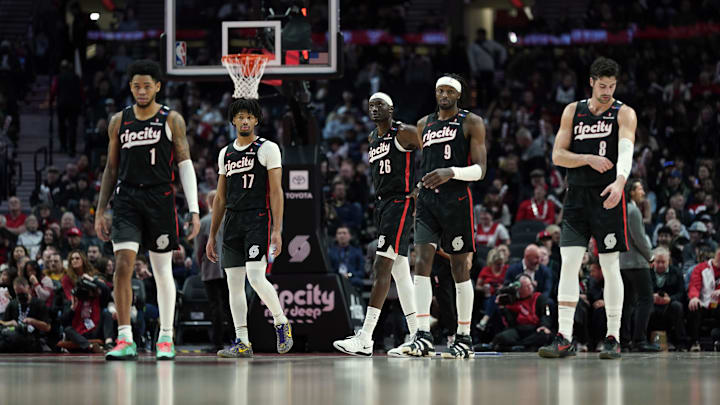 Dec 6, 2024; Portland, Oregon, USA: Portland Trail Blazers (from left to right) Anfernee Simons (1), Shaedon Sharpe (17), Duop Reath (26), Jerami Grant (9), and Deni Avdija (8) walk back to the court after a timeout during the first half against the Utah Jazz at Moda Center. Mandatory Credit: Soobum Im-Imagn Images Dec 6, 2024; Portland, Oregon, USA: Portland Trail Blazers (from left to right) Anfernee Simons (1), Shaedon Sharpe (17), Duop Reath (26), Jerami Grant (9), and Deni Avdija (8) walk back to the court after a timeout during the first half against the Utah Jazz at Moda Center. Mandatory Credit: Soobum Im-Imagn Images