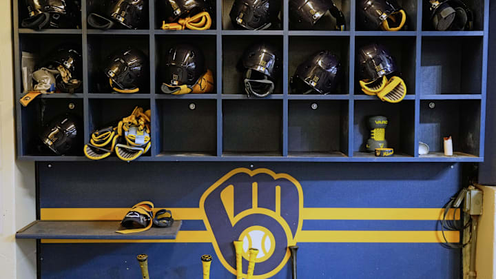 Apr 5, 2025; Milwaukee, Wisconsin, USA; General view of Milwaukee Brewers batting helmets in the dugout prior to the game against the Cincinnati Reds at American Family Field. Mandatory Credit: Jeff Hanisch-Imagn Images Apr 5, 2025; Milwaukee, Wisconsin, USA; General view of Milwaukee Brewers batting helmets in the dugout prior to the game against the Cincinnati Reds at American Family Field. Mandatory Credit: Jeff Hanisch-Imagn Images