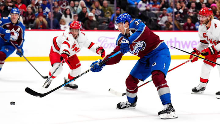 Nov 9, 2024; Denver, Colorado, USA; Colorado Avalanche center Nathan MacKinnon (29) shoots and scores in the second period against the Carolina Hurricanes at Ball Arena. Mandatory Credit: Ron Chenoy-Imagn Images