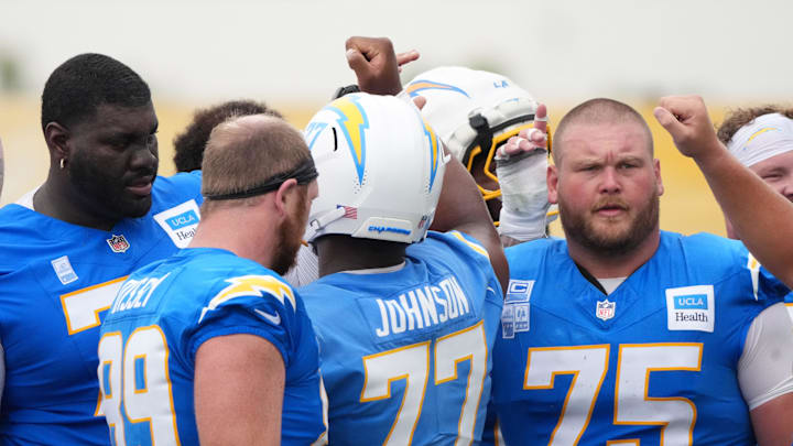Los Angeles Chargers offensive linemen huddle at training camp at The Bolt. 