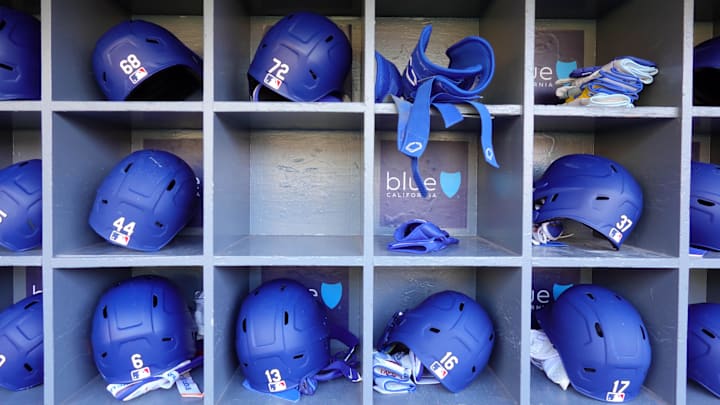 May 20, 2025; Los Angeles, California, USA; Los Angeles Dodgers batting helmets of catcher Dalton Rushing (68), second baseman Miguel Rojas (72), right fielder Andy Pages (44), right fielder Teoscar Hernandez (37), second baseman Hyeseong Kim (6), third baseman Max Muncy (13), catcher Will Smith (16) and designated hitter Shohei Ohtani (17) in the dugout during the game against the Arizona Diamondbacks at Dodger Stadium. Mandatory Credit: Kirby Lee-Imagn Images
