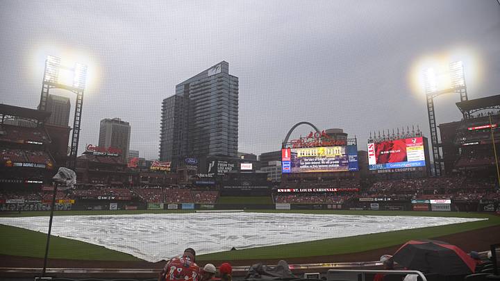 Jul 27, 2024; St. Louis, Missouri, USA; The tarp covers the field during a rain delay ahead of a game between the St. Louis Cardinals and the Washington Nationals at Busch Stadium. Mandatory Credit: Jeff Le-Imagn Images