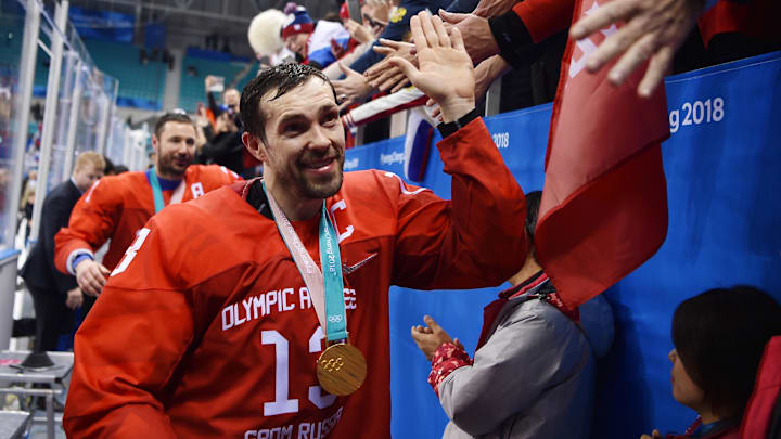 Feb 24, 2018; Gangneung, South Korea; Russia forward Pavel Datsyuk (13) celebrates with fans as he leaves the ice after the men's ice hockey gold medal match against Germany during the Pyeongchang 2018 Olympic Winter Games at Gangneung Hockey Centre. Mandatory Credit: Andrew Nelles-Imagn Images