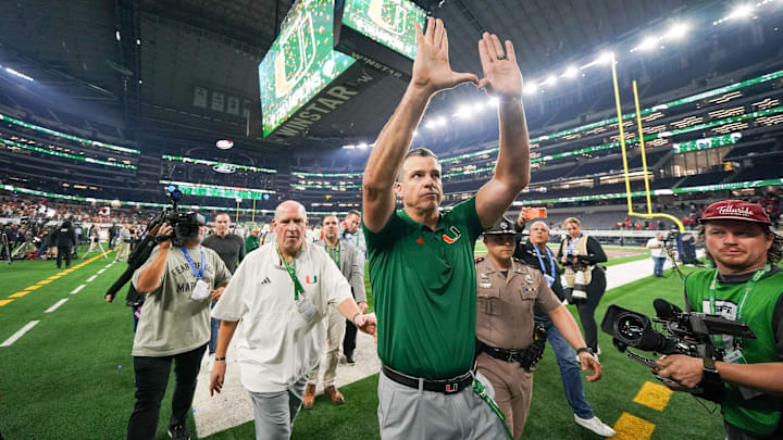 Dec 31, 2025; Arlington, TX, USA; Miami Hurricanes head coach Mario Cristobal leaves the 2025 Cotton Bowl and quarterfinal game of the College Football Playoff against the Ohio State Buckeyes.