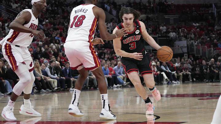 Apr 16, 2025; Chicago, Illinois, USA; Miami Heat guard Alec Burks (18) defends Chicago Bulls guard Josh Giddey (3) during the first quarter at United Center. Apr 16, 2025; Chicago, Illinois, USA; Miami Heat guard Alec Burks (18) defends Chicago Bulls guard Josh Giddey (3) during the first quarter at United Center.