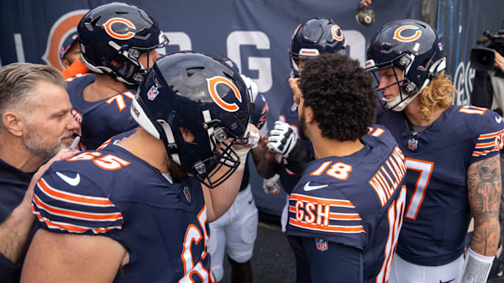 CHICAGO, IL - NOVEMBER 17: Caleb Williams #18 of the Chicago Bears leads a huddle with Tyson Bagent #17 of the Chicago Bears, Coleman Shelton #65 of the Chicago Bears, Ryan Bates #71 of the Chicago Bears, and head coach Matt Eberflus before the game between the Green Bay Packers and the Chicago Bears at Soldier Field on November 17, 2024. 