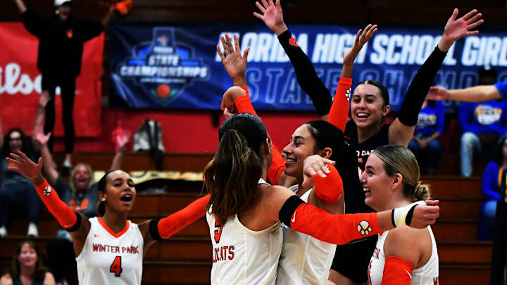 Winter Park players celebrate winning a point against Kissimmee Osceola during a Class 7A semifinal at the FHSAA girls volleyball state tournament on Friday at Polk State College in Winter Haven. Winter Park players celebrate winning a point against Kissimmee Osceola during a Class 7A semifinal at the FHSAA girls volleyball state tournament on Friday at Polk State College in Winter Haven.