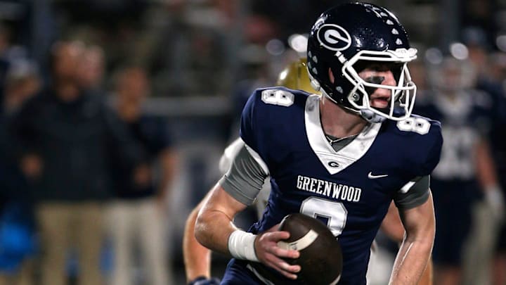 Greenwood's Kane Archer is chased out of the pocket by a Pulaski Academy defender while looking for a receiver during the 5A West Conference game on Oct. 28 at Smith Robinson Stadium.

Greenwood Pul Acad Fb 102822 04