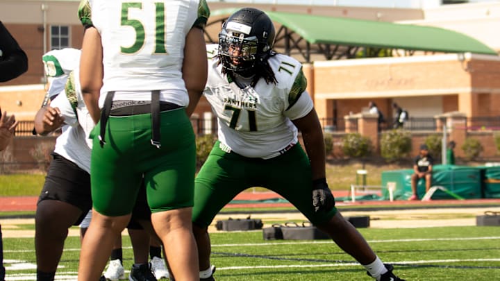 Kelsey Adams partaking in blocking assignment drills in his first spring practice at Langston Hughes High School, Fairburn (GA) 