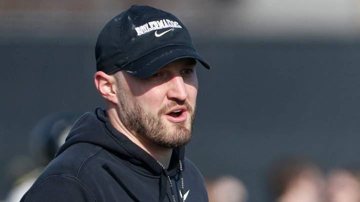 Purdue Boilermakers defensive ends coach Jake Trump yells during a practice. Purdue Boilermakers defensive ends coach Jake Trump yells during a practice.