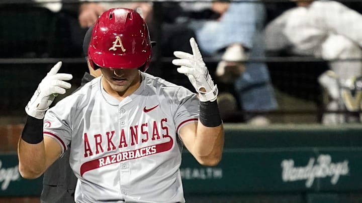 Arkansas catcher Ryder Helfrick (27) celebrates his triple against Vanderbilt during the third inning at Hawkins Field in Nashville, Tenn., Friday, March 28, 2025.