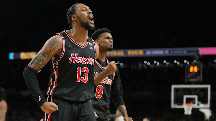 Houston players J'Wan Roberts (13) and Mylik Wilson (8) react after the Cougars pull off a 70-67 win against Duke in the Final Four on April 5, 2025.
