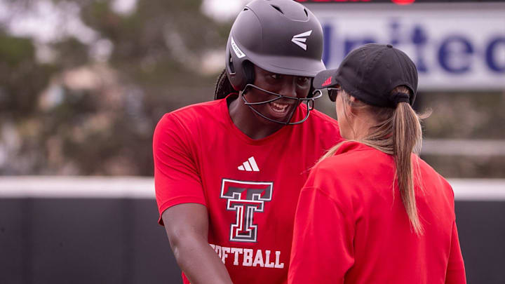 Texas Tech's NiJaree Canady talks to first base coach Tara Archibald during a fall softball exhibition Sunday, October 20, 2024, at Rocky Johnson Field.
