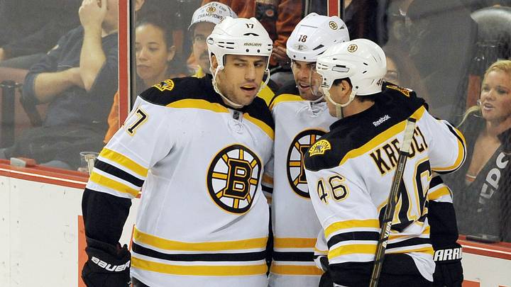 December 17, 2011; Philadelphia, PA USA; Boston Bruins teammates Milan Lucic (17) and David Krejci (46) celebrate a goal by right wing Nathan Horton (middle) against the Philadelphia Flyers during 2nd period of game at the Wells Fargo Center. Mandatory Credit: Eric Hartline-USA TODAY Sports