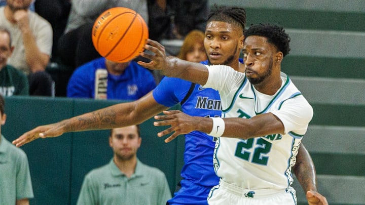 Jan 30, 2025; New Orleans, Louisiana, USA; Tulane Green Wave guard Asher Woods (22) passes the ball against the Memphis Tigers during the first half at Avron B. Fogelman Arena in Devlin Fieldhouse. Jan 30, 2025; New Orleans, Louisiana, USA; Tulane Green Wave guard Asher Woods (22) passes the ball against the Memphis Tigers during the first half at Avron B. Fogelman Arena in Devlin Fieldhouse.