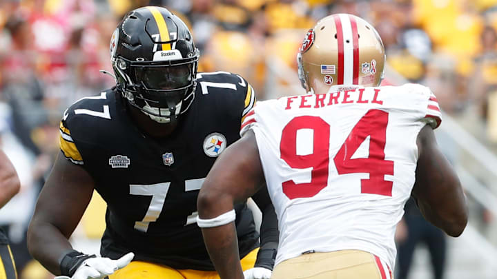 Sep 10, 2023; Pittsburgh, Pennsylvania, USA;  Pittsburgh Steelers offensive tackle Broderick Jones (77) blocks against San Francisco 49ers defensive end Clelin Ferrell (94) during the fourth quarter at Acrisure Stadium. Mandatory Credit: Charles LeClaire-Imagn Images