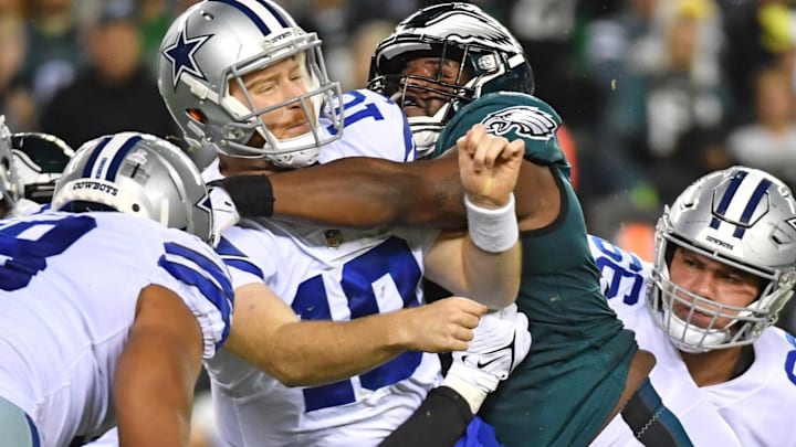 Dallas Cowboys quarterback Cooper Rush is pressured by Philadelphia Eagles defensive tackle Javon Hargrave.