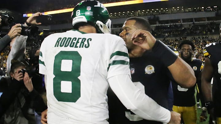 Oct 20, 2024; Pittsburgh, Pennsylvania, USA;  New York Jets quarterback Aaron Rodgers (8) and Pittsburgh Steelers quarterback Russell Wilson (right) greet each other after their game at Acrisure Stadium. Mandatory Credit: Charles LeClaire-Imagn Images