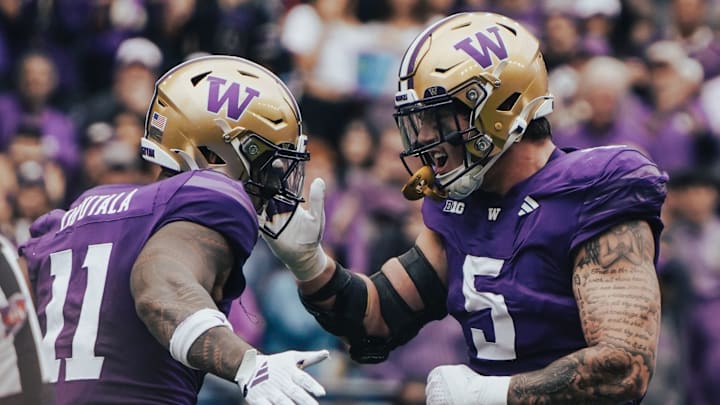 Alphonzo Tuputala and Zach Durfee celebrate a defensive stop. Alphonzo Tuputala and Zach Durfee celebrate a defensive stop.