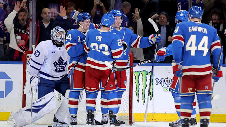 Mar 5, 2026; New York, New York, USA; New York Rangers left wing Alexis Lafreniere (13) celebrates his goal against Toronto Maple Leafs goaltender Joseph Woll (60) with teammates during the third period at Madison Square Garden. Mandatory Credit: Brad Penner-Imagn Images