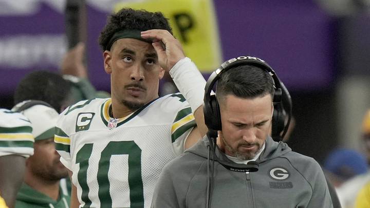 Green Bay Packers quarterback Jordan Love (10) walks behind coach Matt LaFleur after throwing an interception. Green Bay Packers quarterback Jordan Love (10) walks behind coach Matt LaFleur after throwing an interception.