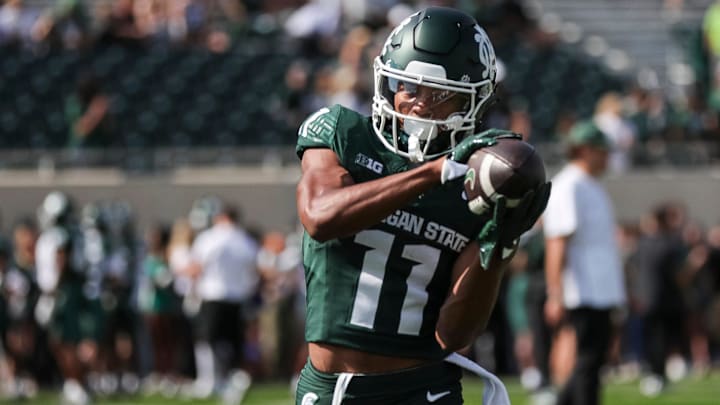 Michigan State wide receiver Aziah Johnson (11) warms up before the Maryland game at Spartan Stadium in East Lansing on Saturday, Sept. 23, 2023.