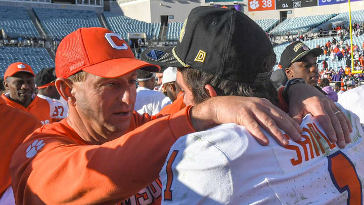 Clemson head coach Dabo Swinney talks with running back Will Shipley (1) after the TaxSlayer Gator Bowl
