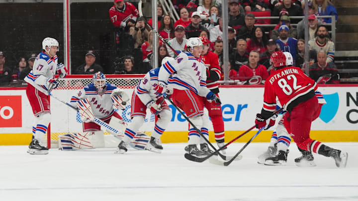Dec 29, 2025; Raleigh, North Carolina, USA;  New York Rangers goaltender Igor Shesterkin (31) watches the shot by Carolina Hurricanes center Jesperi Kotkaniemi (82) during the second period at Lenovo Center. Mandatory Credit: James Guillory-Imagn Images
