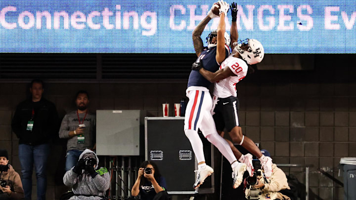 Arizona Wildcats wide receiver Tetairoa McMillan (4) catches the ball to make a touchdown during the first quarter against the Houston Cougars at Arizona Stadium.