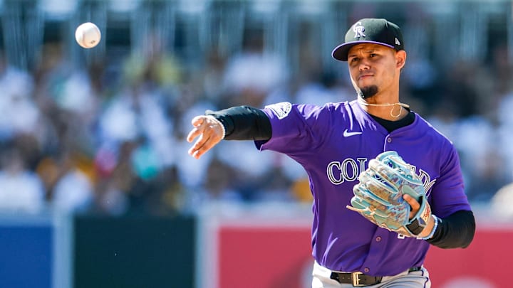 San Diego, California, USA; Colorado Rockies shortstop Ezequiel Tovar (14) throws to first base to complete the double play during the eighth inning against the San Diego Padres at Petco Park.