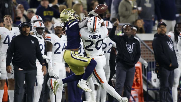Virginia Cavaliers defensive back Jonas Sanker (20) breaks up a pass intended for Georgia Tech Yellow Jackets wide receiver Nate McCollum (8) in the first half at Bobby Dodd Stadium. Virginia Cavaliers defensive back Jonas Sanker (20) breaks up a pass intended for Georgia Tech Yellow Jackets wide receiver Nate McCollum (8) in the first half at Bobby Dodd Stadium.