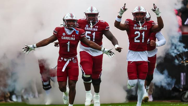 Nov 11, 2023; Columbia, South Carolina, USA; South Carolina Gamecocks defensive back DQ Smith (1), offensive lineman Tree Babalade (51), and defensive back Nick Emmanwori (21) lead their teammates onto the field before a game against the Vanderbilt Commodores at Williams-Brice Stadium. Mandatory Credit: Jeff Blake-USA TODAY Sports