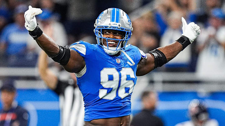 Detroit Lions linebacker Al-Quadin Muhammad (96) celebrates a tackle against Chicago Bears during the second half at Ford Field in Detroit on Sunday, Sept. 14, 2025.