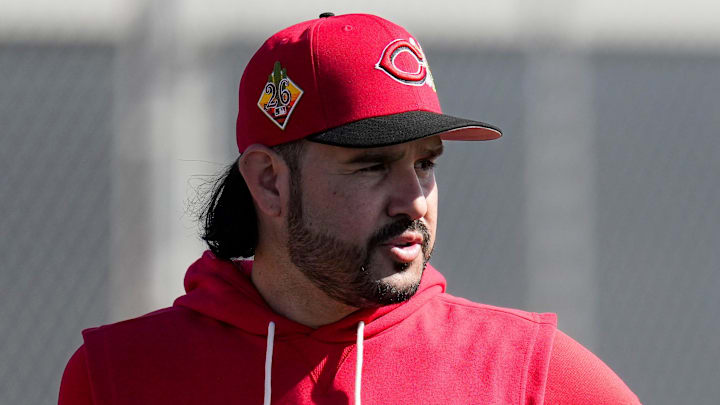 Cincinnati Reds infielder Eugenio Suarez (28) stands by between rounds of a bunting routine at the Cincinnati Reds player development complex in Goodyear, Ariz., on Thursday, Feb. 12, 2026.