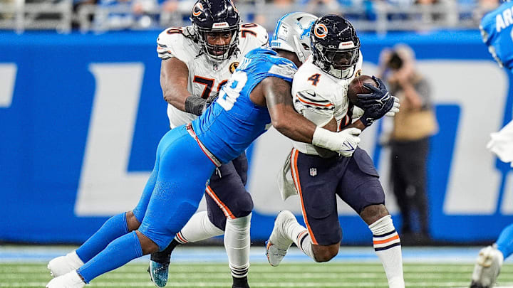 D'Andre Swift can't escape a tackle against the Lions. The Bears starting running back is battling through a groin injury.