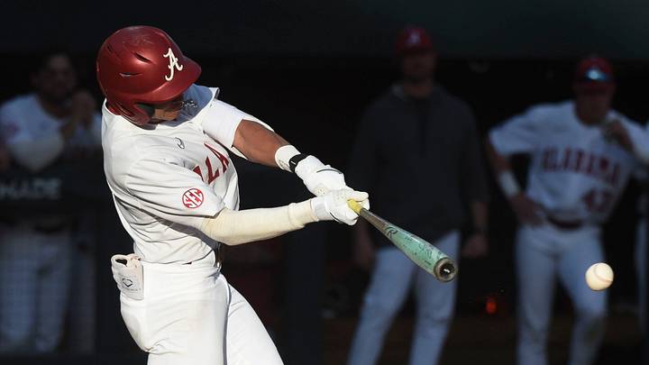 Feb 23, 2024; Tuscaloosa, Alabama, USA; Alabama batter Justin Lebron connects for a hit during the opening game of the weekend series with Valparaiso at Sewell-Thomas Stadium.