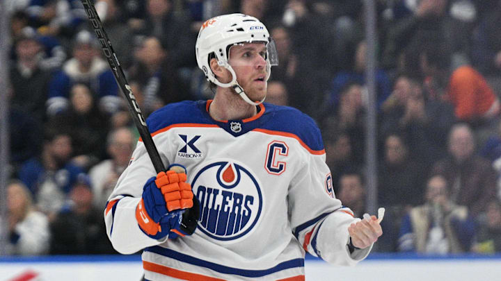 Nov 16, 2024; Toronto, Ontario, CAN;  Edmonton Oilers forward Connor McDavid (97) reacts after being called for a minor penalty against the Toronto Maple Leafs in the second period at Scotiabank Arena. Mandatory Credit: Dan Hamilton-Imagn Images