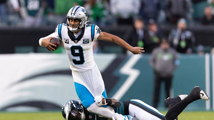 Dec 8, 2024; Philadelphia, Pennsylvania, USA;  Philadelphia Eagles linebacker Jalyx Hunt (58) tackles Carolina Panthers quarterback Bryce Young (9) during the fourth quarter at Lincoln Financial Field. Mandatory Credit: Bill Streicher-Imagn Images