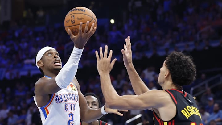 Oct 27, 2024; Oklahoma City, Oklahoma, USA; Oklahoma City Thunder guard Shai Gilgeous-Alexander (2) shoots against Atlanta Hawks forward Zaccharie Risacher (10) during the second half at Paycom Center. Mandatory Credit: Alonzo Adams-Imagn Images