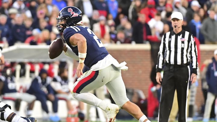 Nov 29, 2024; Oxford, Mississippi, USA; Mississippi Rebels quarterback Jaxson Dart (2) runs the ball against the Mississippi State Bulldogs during the second quarter at Vaught-Hemingway Stadium. Mandatory Credit: Matt Bush-Imagn Images Nov 29, 2024; Oxford, Mississippi, USA; Mississippi Rebels quarterback Jaxson Dart (2) runs the ball against the Mississippi State Bulldogs during the second quarter at Vaught-Hemingway Stadium. Mandatory Credit: Matt Bush-Imagn Images
