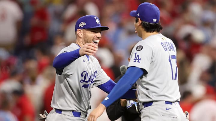 Los Angeles Dodgers first baseman Freddie Freeman (5) and designated hitter Shohei Ohtani (17) celebrate after defeating the Philadelphia Phillies in game two of the NLDS round for the 2025 MLB playoffs at Citizens Bank Park.