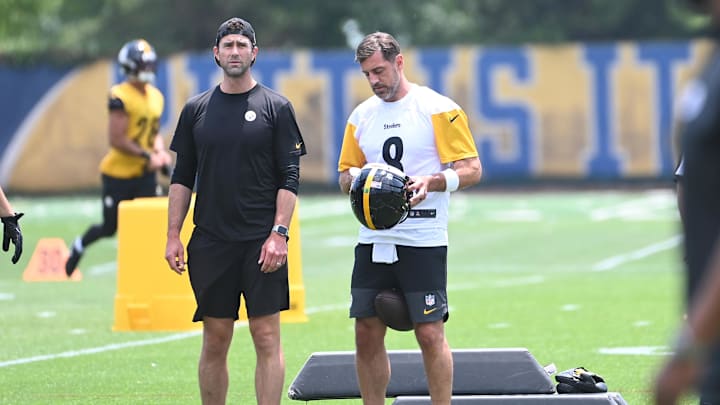 Jun 10, 2025; Pittsburgh, PA, USA;  Pittsburgh Steelers quarterback Aaron Rodgers (8) puts on his helmet during minicamp at their South Side facility. Mandatory Credit: Philip G. Pavely-Imagn Images