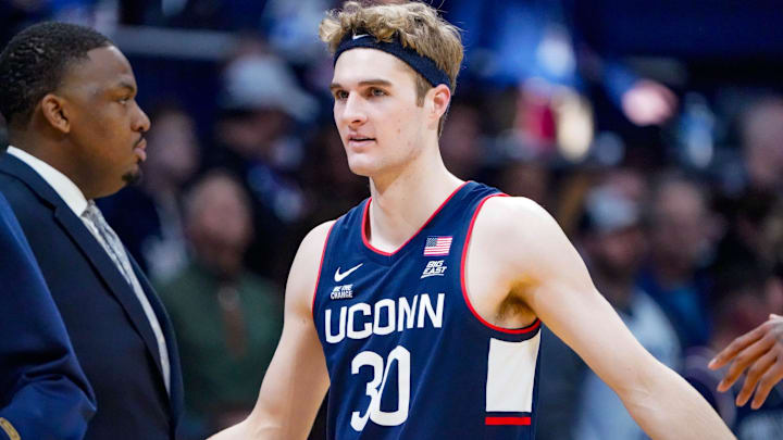 Liam McNeeley (30) celebrates a basket during game between the Butler Bulldogs and the University of Connecticut Husks at Hinkle Fieldhouse on Saturday, Dec. 21, 2024, in Indianapolis.